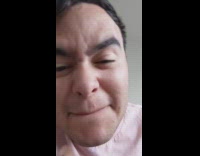 Pink shirt guy smells toilet paper bathroom 