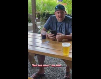 Woman takes pictures of her annoyed boyfriend (BAD SIGNATURE,)