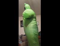 Girl sprays fart smell into green suit 