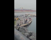 Collab IITW - Man Dances on Harbor Around Many People