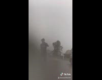 Guy tiktok dances during hurricane storm vans 