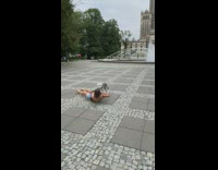 Woman black backless top lie down dog pictorial