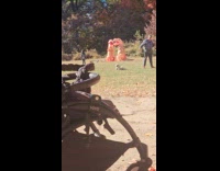 Kid staring at couple wearing dinosaur costume