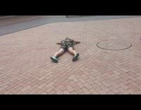 Woman dolphin dives in the middle of shopping center as guy in hot dog suit watches