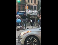 Woman big blue diapers swings mannequin head around on sidewalk